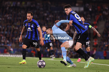 2023-06-10 - Phil Foden of Manchester City, Alessandro Bastoni of Inter Milan during the UEFA Champions League, Final football match between Manchester City FC and FC Internazionale on June 10, 2023 at Ataturk Olympic Stadium in Istanbul, Turkey - FOOTBALL - CHAMPIONS LEAGUE - FINAL - MANCHESTER CITY V INTERNAZIONALE - UEFA CHAMPIONS LEAGUE - SOCCER