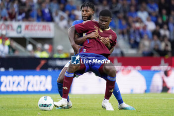 2023-08-02 - Chris Bedia of Servette FC battles for possession with Alexander McKenzie of KRC Genk during the UEFA Champions League, Second qualifying round, 2nd leg football match between KRC Genk and Servette FC on August 2, 2023 at the Cegeka Arena in Genk, Belgium - FOOTBALL - CHAMPIONS LEAGUE - KRC GENK V SERVETTE FC - UEFA CHAMPIONS LEAGUE - SOCCER