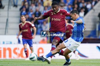 2023-08-02 - Daniel Munoz of KRC Genk battles for possession with Chris Bedia of Servette FC during the UEFA Champions League, Second qualifying round, 2nd leg football match between KRC Genk and Servette FC on August 2, 2023 at the Cegeka Arena in Genk, Belgium - FOOTBALL - CHAMPIONS LEAGUE - KRC GENK V SERVETTE FC - UEFA CHAMPIONS LEAGUE - SOCCER