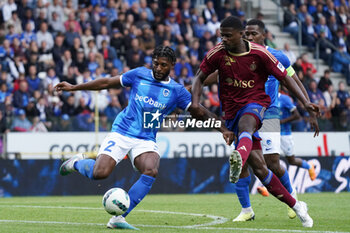 2023-08-02 - Alexander McKenzie of KRC Genk battles for possession with Chris Bedia of Servette FC during the UEFA Champions League, Second qualifying round, 2nd leg football match between KRC Genk and Servette FC on August 2, 2023 at the Cegeka Arena in Genk, Belgium - FOOTBALL - CHAMPIONS LEAGUE - KRC GENK V SERVETTE FC - UEFA CHAMPIONS LEAGUE - SOCCER