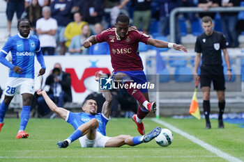 2023-08-02 - Daniel Munoz of KRC Genk battles for possession with Dereck Kutesa of Servette FC during the UEFA Champions League, Second qualifying round, 2nd leg football match between KRC Genk and Servette FC on August 2, 2023 at the Cegeka Arena in Genk, Belgium - FOOTBALL - CHAMPIONS LEAGUE - KRC GENK V SERVETTE FC - UEFA CHAMPIONS LEAGUE - SOCCER