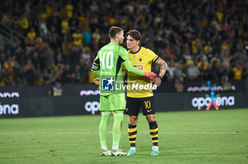 2023-08-19 - 10 Steven Zuber of AEK FC salutes 40 Dominik Livakovic of GNK Dinamo Zagreb after the UEFA Champions League, 3rd Qualification Round match between AEK FC and GNK Dinamo Zagreb at Opap Arena on August 19, 2023, in Athens, Greece. - AEK-DINAMO ZAGREB 3RD QUALIFICATION ROUND - UEFA CHAMPIONS LEAGUE - SOCCER