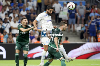 2023-08-16 - Samuel Gigot of Marseille between Filip Mladenovic and Ruben Perez of Panathinaikos during the UEFA Champions League, Third qualifying round, 2nd leg football match between Olympique de Marseille (OM) and Panathinaikos FC (Pana) on August 15, 2023 at Velodrome stadium in Marseille, France - FOOTBALL - CHAMPIONS LEAGUE - MARSEILLE V PANATHINAIKOS - UEFA CHAMPIONS LEAGUE - SOCCER