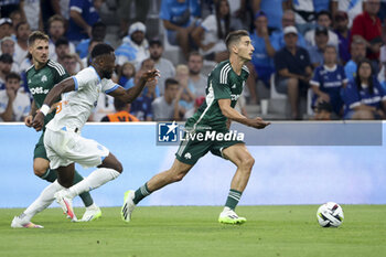 2023-08-16 - Filip Djuricic of Panathinaikos, left Chancel Mbemba of Marseille during the UEFA Champions League, Third qualifying round, 2nd leg football match between Olympique de Marseille (OM) and Panathinaikos FC (Pana) on August 15, 2023 at Velodrome stadium in Marseille, France - FOOTBALL - CHAMPIONS LEAGUE - MARSEILLE V PANATHINAIKOS - UEFA CHAMPIONS LEAGUE - SOCCER