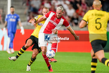 2023-08-22 - Vincent Janssen of Royal Antwerp FC is challenged by Domagoj Vida of AEK Athens during the UEFA Champions League, Play-offs, 1st leg football match between Royal Antwerp FC and AEK Athens on August 22, 2023 at Bosuilstadion in Deurne, Belgium - FOOTBALL - CHAMPIONS LEAGUE - ROYAL ANTWERP V AEK ATHENS - UEFA CHAMPIONS LEAGUE - SOCCER