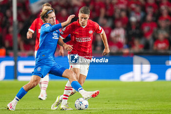 2023-08-30 - Todd Cantwell of Rangers and Joey Veerman of PSV during the UEFA Champions League, Play-offs, 2nd leg football match between PSV and Rangers on August 30, 2023 at the Philips Stadion in Eindhoven, Netherlands - FOOTBALL - CHAMPIONS LEAGUE - PSV V RANGERS - UEFA CHAMPIONS LEAGUE - SOCCER