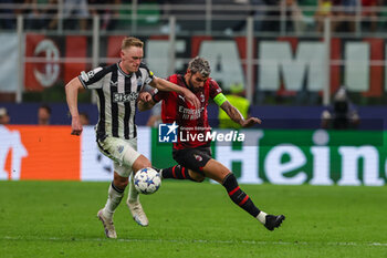2023-09-19 - Theo Hernandez of AC Milan competes for the ball with Kieran Trppier of Newcastle United FC during UEFA Champions League 2023/24 Group Stage - Group F football match between AC Milan and Newcastle United FC at San Siro Stadium, Milan, Italy on September 19, 2023 - AC MILAN VS NEWCASTLE UNITED FC - UEFA CHAMPIONS LEAGUE - SOCCER