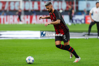 2023-09-19 - Olivier Giroud of AC Milan warms up during UEFA Champions League 2023/24 Group Stage - Group F football match between AC Milan and Newcastle United FC at San Siro Stadium, Milan, Italy on September 19, 2023 - AC MILAN VS NEWCASTLE UNITED FC - UEFA CHAMPIONS LEAGUE - SOCCER