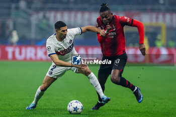 2023-11-07 - Rafael Leao of AC Milan competes for the ball with Achraf Hakimi of Paris Saint-Germain FC during UEFA Champions League 2023/24 Group Stage - Group F football match between AC Milan and Paris Saint-Germain FC at San Siro Stadium, Milan, Italy on November 07, 2023 - AC MILAN VS PARIS SAINT-GERMAIN - UEFA CHAMPIONS LEAGUE - SOCCER