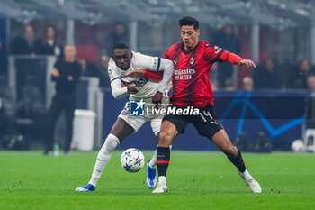 2023-11-07 - Tijjani Reijnders of AC Milan competes for the ball with Randal Kolo Muani of Paris Saint-Germain FC during UEFA Champions League 2023/24 Group Stage - Group F football match between AC Milan and Paris Saint-Germain FC at San Siro Stadium, Milan, Italy on November 07, 2023 - AC MILAN VS PARIS SAINT-GERMAIN - UEFA CHAMPIONS LEAGUE - SOCCER