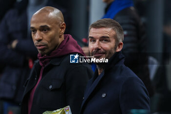 2023-11-07 - Former England, Manchester United, LA Galaxy, and PSG player and actual President and Co-Owner of Inter Miami David Beckham (R) looks on with Thierry Henry (L) during UEFA Champions League 2023/24 Group Stage - Group F football match between AC Milan and Paris Saint-Germain FC at San Siro Stadium, Milan, Italy on November 07, 2023 - AC MILAN VS PARIS SAINT-GERMAIN - UEFA CHAMPIONS LEAGUE - SOCCER