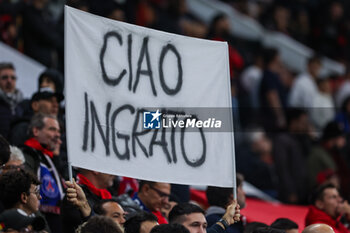2023-11-07 - AC Milan supporter shows a poster against Gianluigi Donnarumma of Paris Saint-Germain FC  during UEFA Champions League 2023/24 Group Stage - Group F football match between AC Milan and Paris Saint-Germain FC at San Siro Stadium, Milan, Italy on November 07, 2023 - AC MILAN VS PARIS SAINT-GERMAIN - UEFA CHAMPIONS LEAGUE - SOCCER