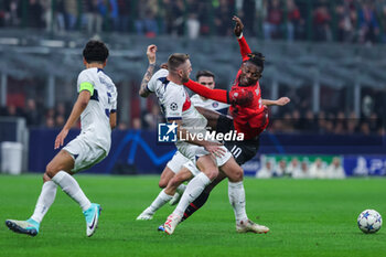 2023-11-07 - Rafael Leao of AC Milan competes for the ball with Milan Skriniar of Paris Saint-Germain FC during UEFA Champions League 2023/24 Group Stage - Group F football match between AC Milan and Paris Saint-Germain FC at San Siro Stadium, Milan, Italy on November 07, 2023 - AC MILAN VS PARIS SAINT-GERMAIN - UEFA CHAMPIONS LEAGUE - SOCCER