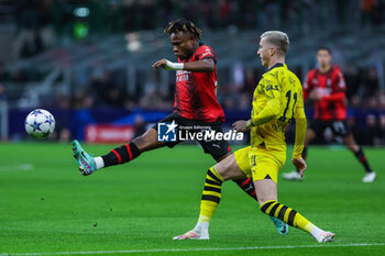 2023-11-28 - Samuel Chukwueze of AC Milan competes for the ball with Marco Reus of Borussia Dortmund during UEFA Champions League 2023/24 Group Stage - Group F football match between AC Milan and Borussia Dortmund at San Siro Stadium, Milan, Italy on November 28, 2023 - AC MILAN VS BORUSSIA DORTMUND - UEFA CHAMPIONS LEAGUE - SOCCER
