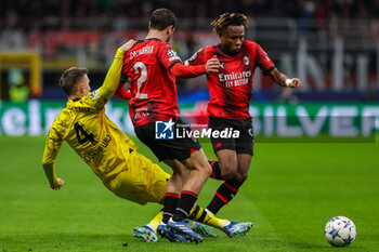 2023-11-28 - Nico Schlotterbeck of Borussia Dortmund competes for the ball with Davide Calabria of AC Milan and Samuel Chukwueze of AC Milan during UEFA Champions League 2023/24 Group Stage - Group F football match between AC Milan and Borussia Dortmund at San Siro Stadium, Milan, Italy on November 28, 2023 - AC MILAN VS BORUSSIA DORTMUND - UEFA CHAMPIONS LEAGUE - SOCCER