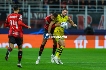 2023-11-28 - Niclas Fullkrug of Borussia Dortmund competes for the ball with Malick Thiaw of AC Milan during UEFA Champions League 2023/24 Group Stage - Group F football match between AC Milan and Borussia Dortmund at San Siro Stadium, Milan, Italy on November 28, 2023 - AC MILAN VS BORUSSIA DORTMUND - UEFA CHAMPIONS LEAGUE - SOCCER