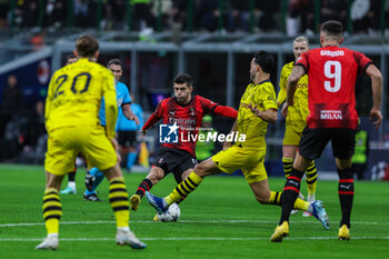 2023-11-28 - Christian Pulisic of AC Milan seen in action during UEFA Champions League 2023/24 Group Stage - Group F football match between AC Milan and Borussia Dortmund at San Siro Stadium, Milan, Italy on November 28, 2023 - AC MILAN VS BORUSSIA DORTMUND - UEFA CHAMPIONS LEAGUE - SOCCER