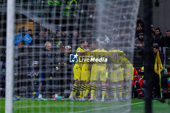 2023-11-28 - Jamie Bynoe-Gittens of Borussia Dortmund celebrates after scoring a goal during UEFA Champions League 2023/24 Group Stage - Group F football match between AC Milan and Borussia Dortmund at San Siro Stadium, Milan, Italy on November 28, 2023 - AC MILAN VS BORUSSIA DORTMUND - UEFA CHAMPIONS LEAGUE - SOCCER