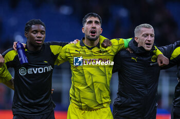 2023-11-28 - Emre Can of Borussia Dortmund celebrates the victory at the end of the match during UEFA Champions League 2023/24 Group Stage - Group F football match between AC Milan and Borussia Dortmund at San Siro Stadium, Milan, Italy on November 28, 2023 - AC MILAN VS BORUSSIA DORTMUND - UEFA CHAMPIONS LEAGUE - SOCCER