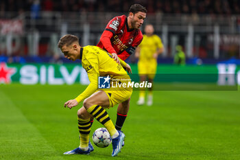 2023-11-28 - Davide Calabria of AC Milan competes for the ball with Nico Schlotterbeck of Borussia Dortmund during UEFA Champions League 2023/24 Group Stage - Group F football match between AC Milan and Borussia Dortmund at San Siro Stadium, Milan, Italy on November 28, 2023 - AC MILAN VS BORUSSIA DORTMUND - UEFA CHAMPIONS LEAGUE - SOCCER