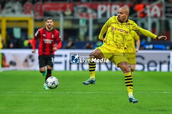 2023-11-28 - Donyell Malen of Borussia Dortmund seen in action during UEFA Champions League 2023/24 Group Stage - Group F football match between AC Milan and Borussia Dortmund at San Siro Stadium, Milan, Italy on November 28, 2023 - AC MILAN VS BORUSSIA DORTMUND - UEFA CHAMPIONS LEAGUE - SOCCER