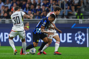 2023-10-03 - Lautaro Martinez of FC Internazionale competes for the ball with Nicolas Otamendi of SL Benfica during the UEFA Champions League 2023/24 Group Stage - Group D football match between FC Internazionale and SL Benfica at Giuseppe Meazza Stadium, Milan, Italy on October 03, 2023 - INTER - FC INTERNAZIONALE VS SL BENFICA - UEFA CHAMPIONS LEAGUE - SOCCER