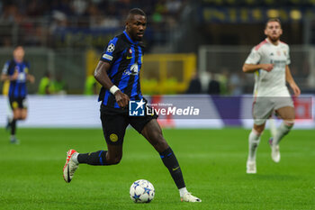 2023-10-03 - Marcus Thuram of FC Internazionale seen in action during the UEFA Champions League 2023/24 Group Stage - Group D football match between FC Internazionale and SL Benfica at Giuseppe Meazza Stadium, Milan, Italy on October 03, 2023 - INTER - FC INTERNAZIONALE VS SL BENFICA - UEFA CHAMPIONS LEAGUE - SOCCER
