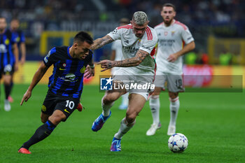2023-10-03 - Lautaro Martinez of FC Internazionale competes for the ball with Morato of SL Benfica during the UEFA Champions League 2023/24 Group Stage - Group D football match between FC Internazionale and SL Benfica at Giuseppe Meazza Stadium, Milan, Italy on October 03, 2023 - INTER - FC INTERNAZIONALE VS SL BENFICA - UEFA CHAMPIONS LEAGUE - SOCCER