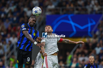 2023-10-03 - Marcus Thuram of FC Internazionale seen in action with Nicolas Otamendi of SL Benfica during the UEFA Champions League 2023/24 Group Stage - Group D football match between FC Internazionale and SL Benfica at Giuseppe Meazza Stadium, Milan, Italy on October 03, 2023 - INTER - FC INTERNAZIONALE VS SL BENFICA - UEFA CHAMPIONS LEAGUE - SOCCER