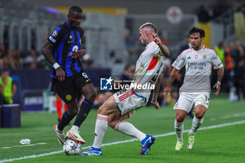 2023-10-03 - Marcus Thuram of FC Internazionale competes for the ball with Morato of SL Benfica during the UEFA Champions League 2023/24 Group Stage - Group D football match between FC Internazionale and SL Benfica at Giuseppe Meazza Stadium, Milan, Italy on October 03, 2023 - INTER - FC INTERNAZIONALE VS SL BENFICA - UEFA CHAMPIONS LEAGUE - SOCCER