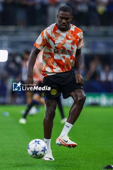 2023-10-03 - Marcus Thuram of FC Internazionale warms up during the UEFA Champions League 2023/24 Group Stage - Group D football match between FC Internazionale and SL Benfica at Giuseppe Meazza Stadium, Milan, Italy on October 03, 2023 - INTER - FC INTERNAZIONALE VS SL BENFICA - UEFA CHAMPIONS LEAGUE - SOCCER