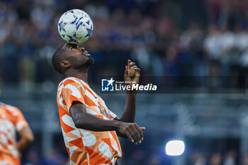 2023-10-03 - Marcus Thuram of FC Internazionale warms up during the UEFA Champions League 2023/24 Group Stage - Group D football match between FC Internazionale and SL Benfica at Giuseppe Meazza Stadium, Milan, Italy on October 03, 2023 - INTER - FC INTERNAZIONALE VS SL BENFICA - UEFA CHAMPIONS LEAGUE - SOCCER