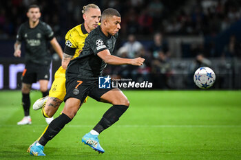 2023-09-19 - Marius WOLF of Borussia Dortmund and Kylian MBAPPE of PSG during the UEFA Champions League, Group F football match between Paris Saint Germain and Borussia Dortmund on September 19, 2023 at Parc des Princes stadium in Paris, France - FOOTBALL - UEFA CHAMPIONS LEAGUE - PARIS SG V BORUSSIA DORTMUND - UEFA CHAMPIONS LEAGUE - SOCCER