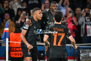 2023-09-19 - Kylian MBAPPE of PSG celebrate his goal with Ousmane DEMBELE of PSG and Vitor MACHADO FERREIRA (Vitinha) of PSG during the UEFA Champions League, Group F football match between Paris Saint Germain and Borussia Dortmund on September 19, 2023 at Parc des Princes stadium in Paris, France - FOOTBALL - UEFA CHAMPIONS LEAGUE - PARIS SG V BORUSSIA DORTMUND - UEFA CHAMPIONS LEAGUE - SOCCER