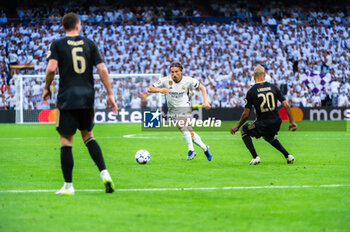 2023-09-20 - Luka Modric (Real Madrid) in action against Aissa Laidouni (Union Berlin) and Robin Gosens (Union Berlin) during the football match between Real Madrid and Union Berlin valid for the matchday 01 of the Uefa Champions League played at Santiago Bernabeu stadium on September 20, 2023 in Madrid, Spain - REAL MADRID VS UNION BERLIN - UEFA CHAMPIONS LEAGUE - SOCCER