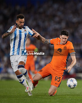 2023-09-20 - Brais Mendez of Real Sociedad competes for the ball with Alessandro Bastoni of FC Internazionale during the UEFA Champions League match between Real Sociedad and FC Internazionale at Reale Arena on September 20, 2023, in San Sebastian, Spain. Photo Ricardo Larreina / SpainDPPi / DPPI - FOOTBALL - CHAMPIONS LEAGUE - REAL SOCIEDAD V FC INTERNAZIONLE - UEFA CHAMPIONS LEAGUE - SOCCER