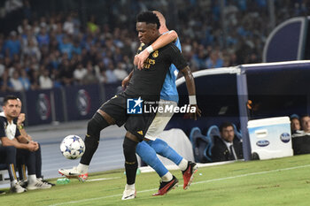 2023-10-03 - Vinicius Junior of Real Madrid FC competes for the ball with Leo Ostigard of SSC Napoli during the Uefa Champions League between SSC Napoli vs Real Madrid FC at Diego Armando Maradona Stadium - SSC NAPOLI VS REAL MADRID FC - UEFA CHAMPIONS LEAGUE - SOCCER