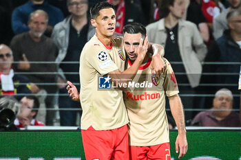 2023-10-03 - Adrien THOMASSON of Lens celebrate his goal with Florian SOTOCA of Lens during the UEFA Champions League, Group B football match between RC Lens and Arsenal FC on October 3, 2023 at Bollaert-Delelis stadium in Lens, France - FOOTBALL - CHAMPIONS LEAGUE - LENS V ARSENAL - UEFA CHAMPIONS LEAGUE - SOCCER