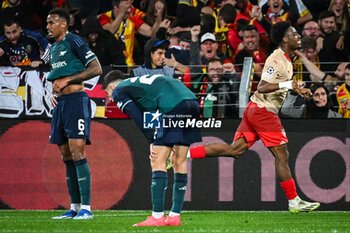 2023-10-03 - Elye WAHI of Lens celebrates his goal and Gabriel MAGALHAES of Arsenal looks dejected during the UEFA Champions League, Group B football match between RC Lens and Arsenal FC on October 3, 2023 at Bollaert-Delelis stadium in Lens, France - FOOTBALL - CHAMPIONS LEAGUE - LENS V ARSENAL - UEFA CHAMPIONS LEAGUE - SOCCER