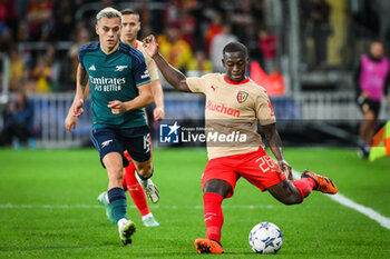 2023-10-03 - Leandro TROSSARD of Arsenal and Nampalys MENDY of Lens during the UEFA Champions League, Group B football match between RC Lens and Arsenal FC on October 3, 2023 at Bollaert-Delelis stadium in Lens, France - FOOTBALL - CHAMPIONS LEAGUE - LENS V ARSENAL - UEFA CHAMPIONS LEAGUE - SOCCER