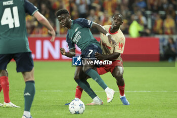 2023-10-03 - Bukayo Saka of Arsenal, Deiver Machado of Lens during the UEFA Champions League, Group B football match between RC Lens and Arsenal FC on October 3, 2023 at Bollaert-Delelis stadium in Lens, France - FOOTBALL - CHAMPIONS LEAGUE - LENS V ARSENAL - UEFA CHAMPIONS LEAGUE - SOCCER
