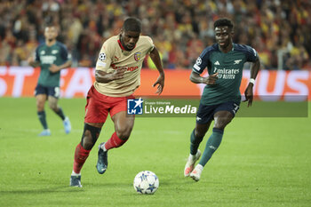 2023-10-03 - Kevin Danso of Lens, Bukayo Saka of Arsenal during the UEFA Champions League, Group B football match between RC Lens and Arsenal FC on October 3, 2023 at Bollaert-Delelis stadium in Lens, France - FOOTBALL - CHAMPIONS LEAGUE - LENS V ARSENAL - UEFA CHAMPIONS LEAGUE - SOCCER