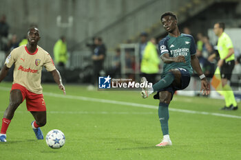 2023-10-03 - Bukayo Saka of Arsenal, left Deiver Machado of Lens during the UEFA Champions League, Group B football match between RC Lens and Arsenal FC on October 3, 2023 at Bollaert-Delelis stadium in Lens, France - FOOTBALL - CHAMPIONS LEAGUE - LENS V ARSENAL - UEFA CHAMPIONS LEAGUE - SOCCER