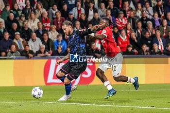 2023-10-03 - Sergio Ramos of Sevilla FC and Johan Bakayoko of PSV during the UEFA Champions League, Group B football match between PSV Eindhoven and Sevilla FC on October 3, 2023 at the Phillips Stadion in Eindhoven, Netherlands - FOOTBALL - CHAMPIONS LEAGUE - PSV EINDHOVEN V SEVILLA - UEFA CHAMPIONS LEAGUE - SOCCER