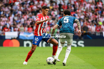 2023-10-04 - Nahuel Molina of Atletico de Madrid and Quilindschy Hartman of Feyenoord during the UEFA Champions League, Group E football match between Atletico de Madrid and Feyenoord on October 4, 2023 at Civitas Metropolitano stadium in Madrid, Spain - FOOTBALL - CHAMPIONS LEAGUE - ATLETICO V FEYENOORD - UEFA CHAMPIONS LEAGUE - SOCCER
