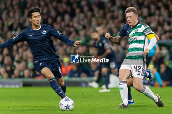 04/10/2023 - Callum McGregor of Celtic and Daichi Kamada of SS Lazio during the UEFA Champions League, Group E football match between Celtic and SS Lazio on 4 October 2023 at Celtic Park in Glasgow, Scotland - FOOTBALL - CHAMPIONS LEAGUE - CELTIC V LAZIO - UEFA CHAMPIONS LEAGUE - CALCIO