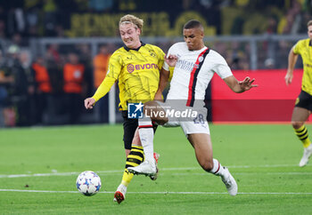 2023-10-04 - Julian Brandt of Borussia Dortmund and Malick Thiaw of AC Milan during the UEFA Champions League, Group F football match between Borussia Dortmund and AC Milan on October 4, 2023 at Signal Iduna Park in Dortmund, Germany - FOOTBALL - CHAMPIONS LEAGUE - DORTMUND V MILAN - UEFA CHAMPIONS LEAGUE - SOCCER