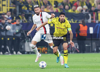 2023-10-04 - Emre Can of Borussia Dortmund and Olivier Giroud of AC Milan during the UEFA Champions League, Group F football match between Borussia Dortmund and AC Milan on October 4, 2023 at Signal Iduna Park in Dortmund, Germany - FOOTBALL - CHAMPIONS LEAGUE - DORTMUND V MILAN - UEFA CHAMPIONS LEAGUE - SOCCER