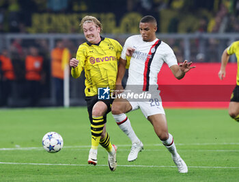 2023-10-04 - Julian Brandt of Borussia Dortmund and Malick Thiaw of AC Milan during the UEFA Champions League, Group F football match between Borussia Dortmund and AC Milan on October 4, 2023 at Signal Iduna Park in Dortmund, Germany - FOOTBALL - CHAMPIONS LEAGUE - DORTMUND V MILAN - UEFA CHAMPIONS LEAGUE - SOCCER