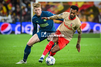 2023-10-24 - Jerdy SCHOUTEN of PSV Eindhoven and Angelo FULGINI of Lens during the UEFA Champions League, Group B football match between RC Lens and PSV Eindhoven on October 24, 2023 at Bollaert-Delelis stadium in Lens, France - FOOTBALL - CHAMPIONS LEAGUE - LENS V PSV - UEFA CHAMPIONS LEAGUE - SOCCER